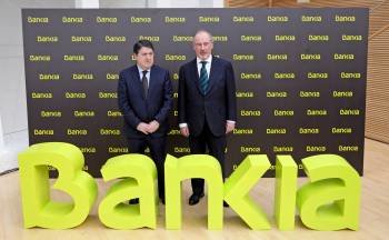 Olivas y Rato en la presentación de Bankia, fruto de la unión de Caja Madrid, Bancaja y otras cinco cajas. (Foto: ARCHIVO)