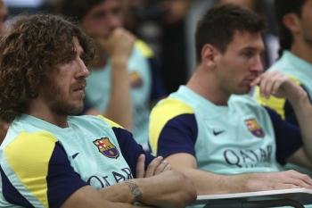 Puyol y Messi se ejercitaron al margen del grupo. (Foto: EFE )
