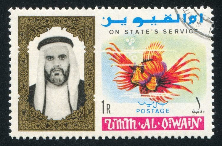 UMM AL-QUWAIN - CIRCA 1972: stamp printed by Umm al-Quwain, shows Sheikh and Fish, circa 1972