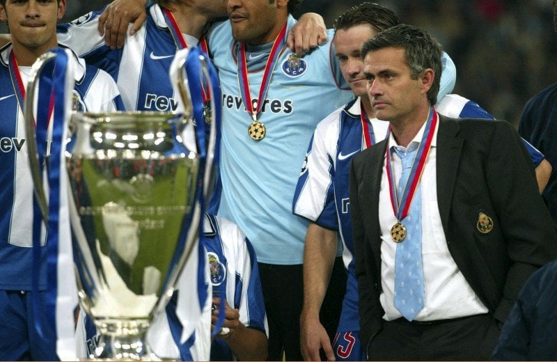 Football - AS Monaco v FC Porto -  UEFA Champions League Final 03/04 - Arena AufSchalke, Gelsenkirchen, Germany - 26/5/04
Porto manager Jose Mourinho does not join in the celebrations with his players
Mandatory Credit: Action Images / Michael Regan
Livepic