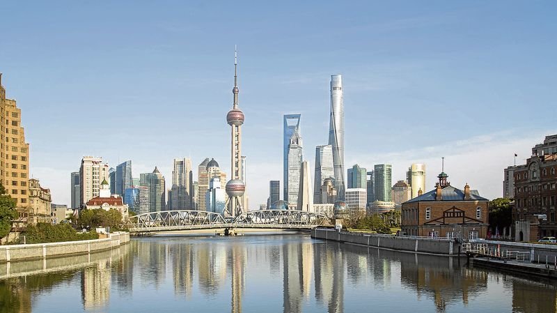 The twisting Shanghai Tower (right) is the world's second-tallest building and opens soon.