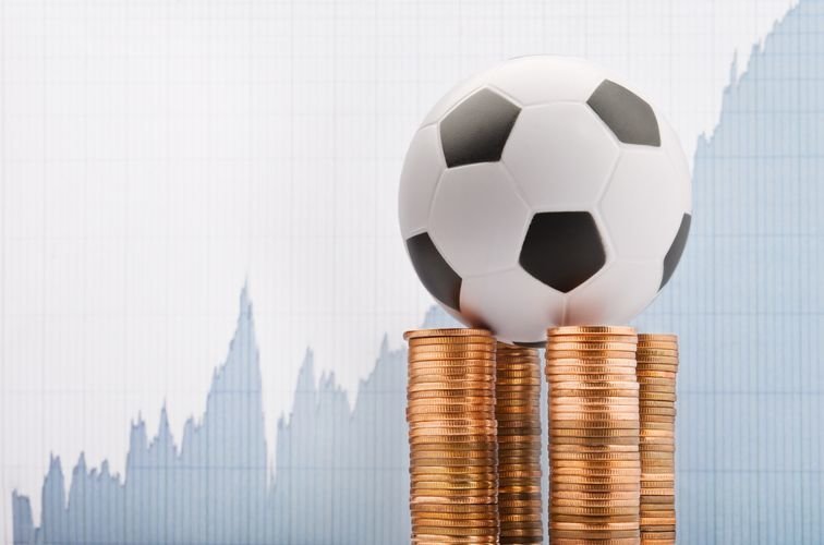 Soccer ball on a financial report background
