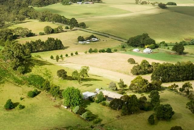 View from above of a patchwork of fields and small farmsteads, Victoria, Australia
