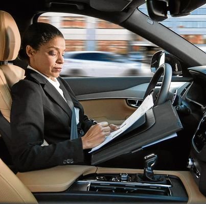 (FILES) This file handout picture provided by Swedish carmaker Volvo taken on April 27, 2016 shows a woman reading inside a so-called autonomous driving (AD) car. Swedish carmaker Volvo Cars said on November 20, 2017 it has signed an agreement to supply "tens of thousands" of self-driving cars to the ride-sharing company, Uber, which has been hit by a series of controversies.  / AFP PHOTO / VOLVO / Handout / RESTRICTED TO EDITORIAL USE - MANDATORY CREDIT "AFP PHOTO /VOLVO / HANDOUT" - NO MARKETING NO ADVERTISING CAMPAIGNS - DISTRIBUTED AS A SERVICE TO CLIENTS  HANDOUT/AFP/Getty Images