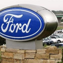 Cartel con la imagen corporativa de Ford.
