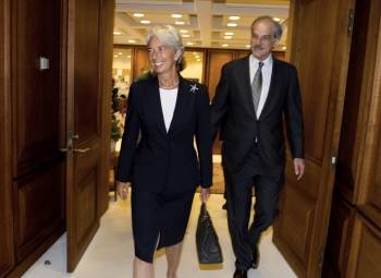 Lagarde con el director suplente del Fondo Monetario Internacional, Lipsky, al llegar a la sede del FMI (Foto: M.Spilotro)
