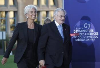 La directora del FMI, Christine Lagarde, y el presidente del BCE, Jean-Claude Trichet, en Marsella. (Foto: HORCAJUELO)