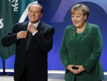 Agela Merkel con Silvio Berlusconi en la cumbre del G20 celebrada en Cannes (Foto: Chema Moya)
