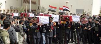 Imagen cedida por la agencia oficial de noticias de Siria (SANA), del funeral celebrado por varios policías fallecidos, en el hospital Harasta, Damasco, Siria, el 12 de marzo del 2012.EFE