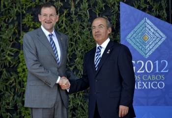Mariano Rajoy, con el presidente de México, Felipe Calderón. (Foto: DIEGO CRESPO)