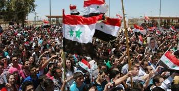 Estudiantes de la universidad Al-Baath, en Homs, en una manifestación de apoyo al régimen sirio.