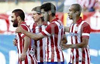 De izquierda a derecha: Arda Turan, Filipe Luis, Raúl García y Joeo Miranda celebran un gol del Atlético contra el Rayo. (Foto: EFE)