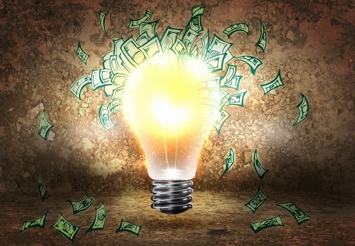 Conceptual image of light bulb and dollar banknotes