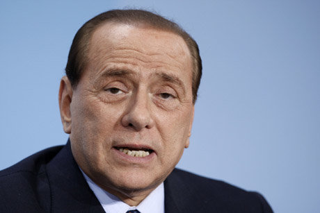 Italian Prime Minister Silvio Berlusconi speaks during a press conference after a meeting in Berlin, Germany, Sunday, Feb. 22, 2009.  European leaders backed sweeping new regulations for financial markets and hedge funds at a summit Sunday in Berlin as politicians and nations scrambled to tame the global economic crisis. (AP Photo/Michael Sohn) Europe Germany Financial Summit