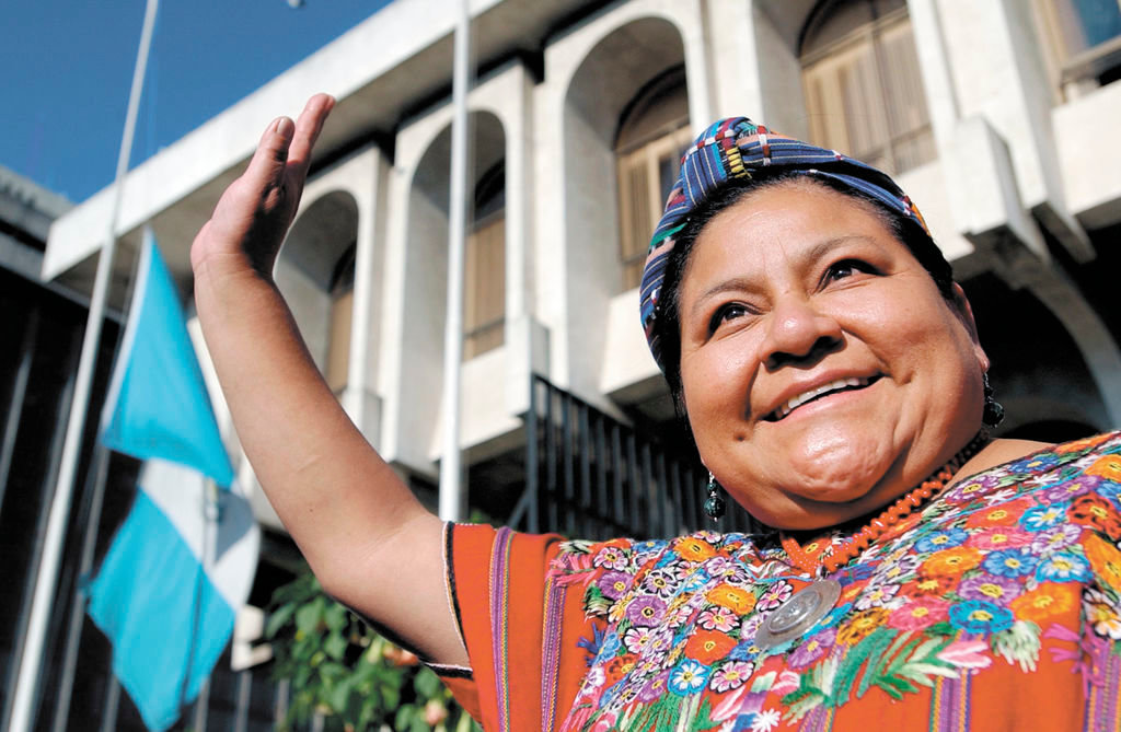 Rigoberta Menchu Tum, Nobel Peace Prize winner from 1992, greets supporters as she leaves the Justice Palace in Guatemala City, Monday, April 4, 2005.  Five people, one of them former dictator General Rios Montt's grandson,  were condemned today with charges of racial discrimination. (AP Photo/Rodrigo Abd) **EFE OUT**