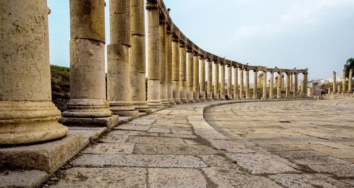 Romand and Ancient Greek typical columns in Rome City of Jerash in Jordan. Columns are offset on the lef side of photo
